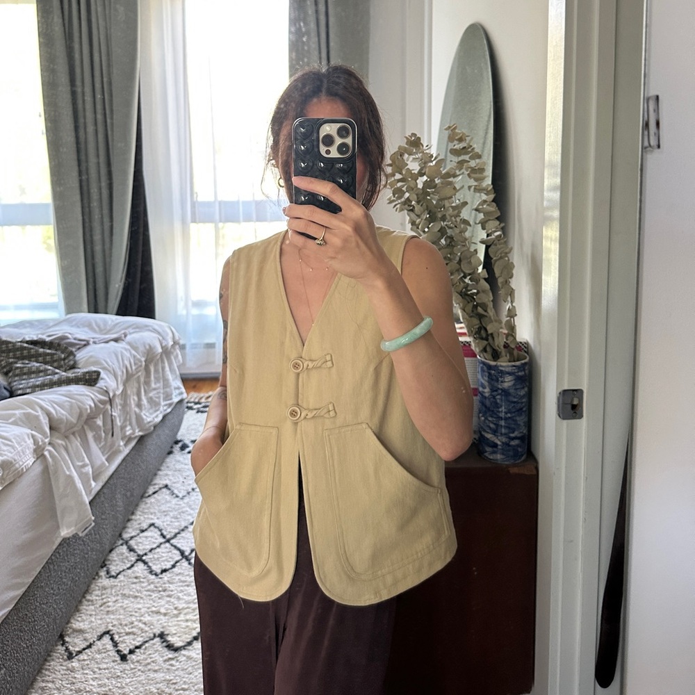 Tan vest with toggle knot closures